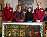 The stained glass team at Salisbury Cathedral left to right Head Glass Conservator Sam Kelly with Vicky Pearce Kate Kersey and Alfie Durrant