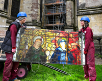 Vicky Pearce left and Kate Kersey right lift a heavy section of Angeli Ministrantes down from the scaffold