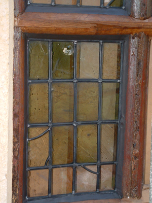 Releaded light fitted into as much glass conserved as possible